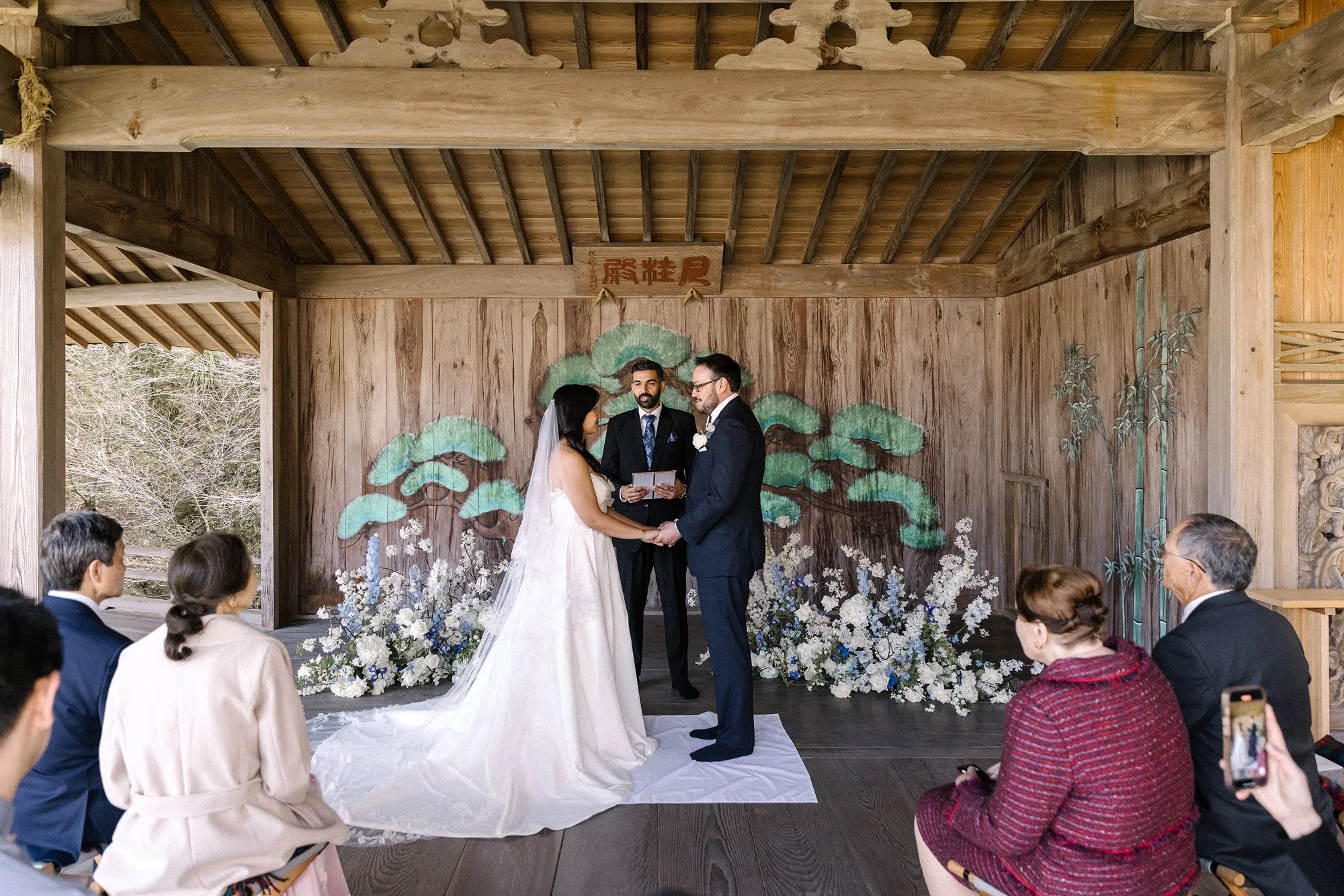 The couple make their promises on a noh stage, their guests seated around them, in Shuzenji, Izu.