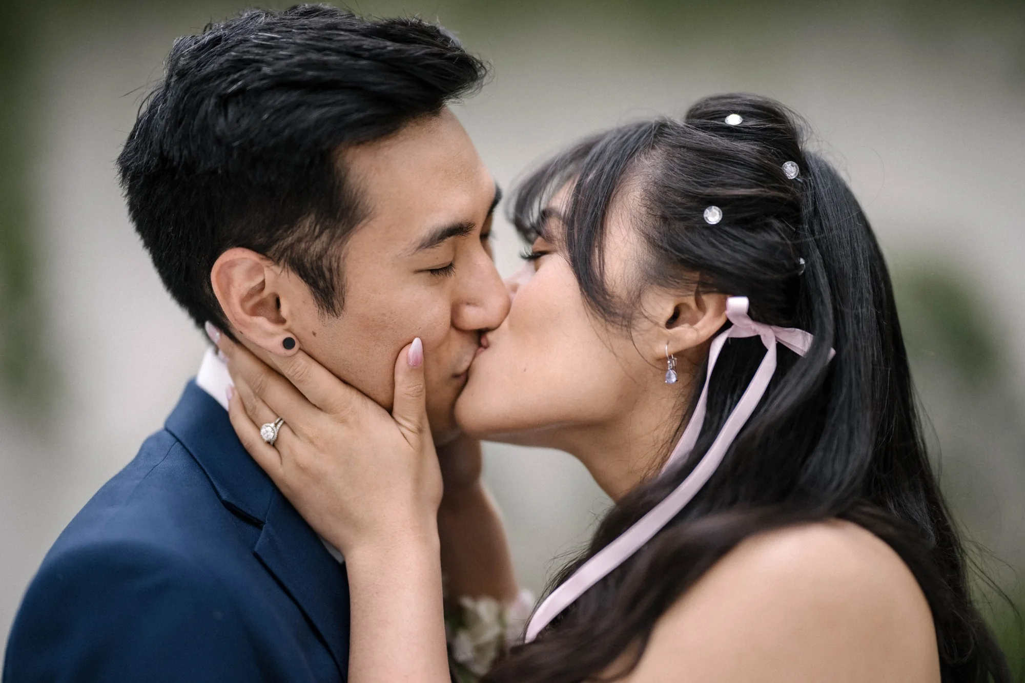 The couple share a close kiss at an intimate wedding in Tokyo.